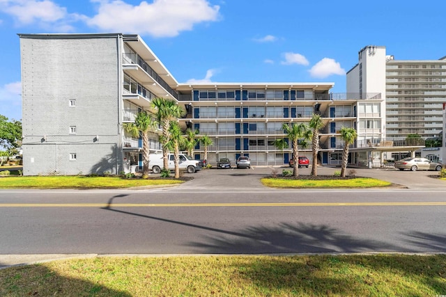 2010 S Ocean Blvd, Myrtle Beach, SC 29577 - view of apartment building / complex featuring uncovered parking