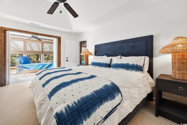 bedroom with a ceiling fan, lofted ceiling, carpet, and visible vents