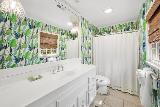 bathroom featuring vanity, wallpapered walls, tile patterned flooring, toilet, and visible vents