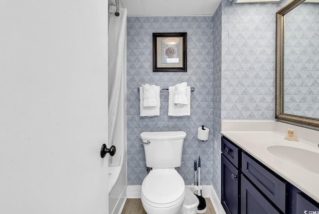 161 Sea Watch Dr Unit 614, Myrtle Beach, SC 29572 - bathroom featuring vanity, toilet, and shower / bathtub combination with curtain