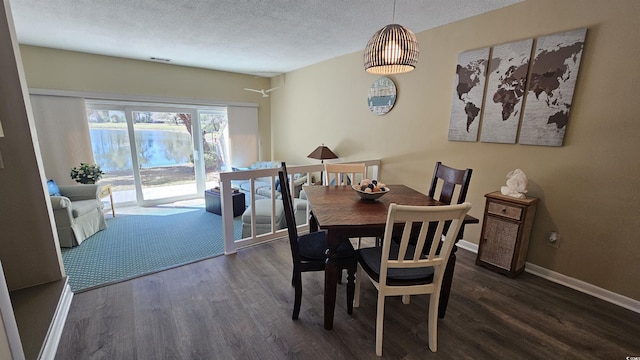 5 Gate 1 Unit 5, Calabash, NC 28467 - dining space with wood finished floors, a textured ceiling, and baseboards