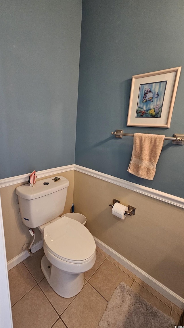 5 Gate 1 Unit 5, Calabash, NC 28467 - bathroom featuring tile patterned floors, toilet, and baseboards