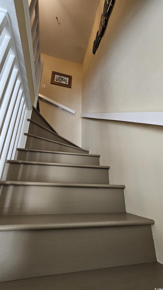 5 Gate 1 Unit 5, Calabash, NC 28467 - staircase with a textured ceiling