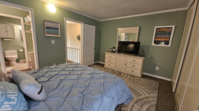 5 Gate 1 Unit 5, Calabash, NC 28467 - carpeted bedroom featuring crown molding, a textured ceiling, baseboards, and ensuite bath