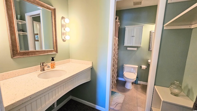 5 Gate 1 Unit 5, Calabash, NC 28467 - bathroom with toilet, vanity, tile patterned floors, and baseboards