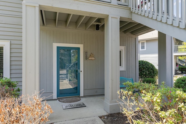 view of exterior entry with covered porch