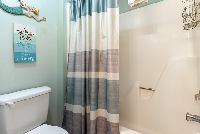 full bath featuring toilet and a shower with curtain