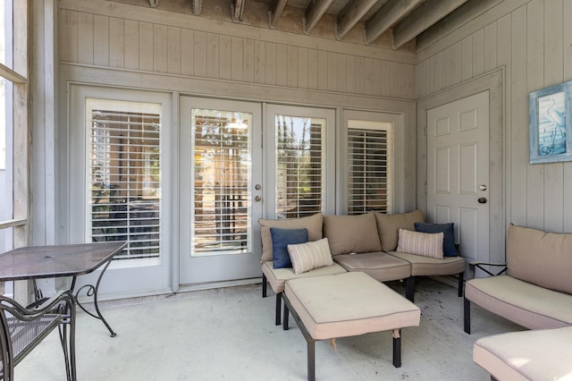 sunroom with an outdoor living space