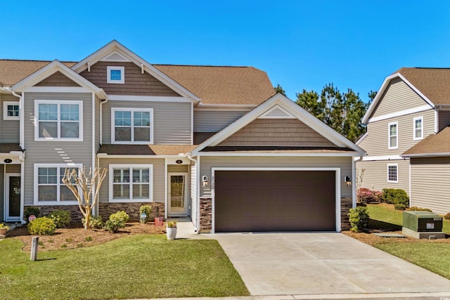 212 Machrie Loop Unit D, Myrtle Beach, SC 29588 - craftsman-style house featuring a front yard, stone siding, a garage, and concrete driveway