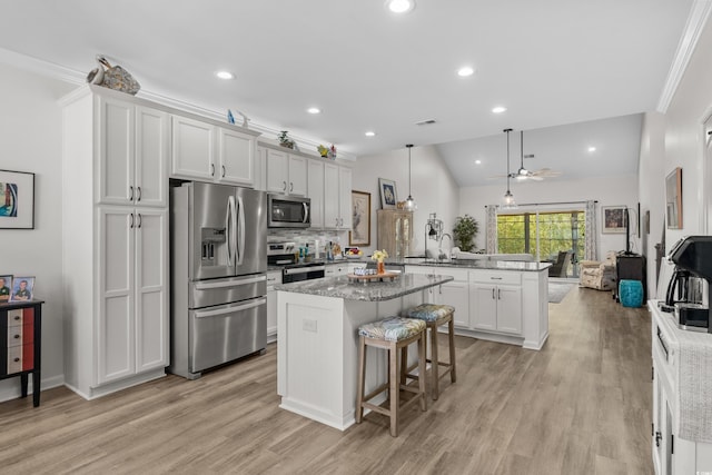 212 Machrie Loop Unit D, Myrtle Beach, SC 29588 - kitchen with a kitchen island, tasteful backsplash, appliances with stainless steel finishes, a peninsula, and ceiling fan