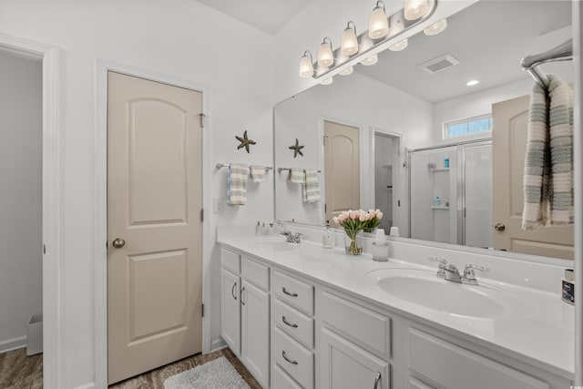 212 Machrie Loop Unit D, Myrtle Beach, SC 29588 - bathroom with double vanity, a sink, a stall shower, and visible vents