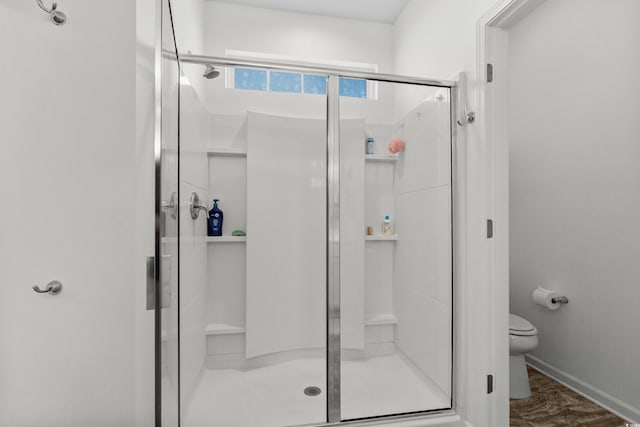 212 Machrie Loop Unit D, Myrtle Beach, SC 29588 - bathroom featuring baseboards, toilet, and a stall shower