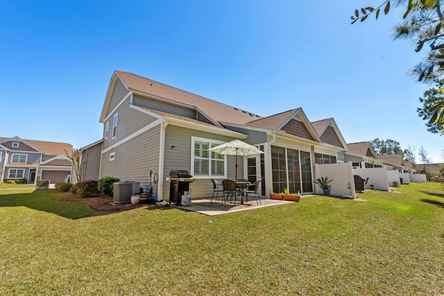 212 Machrie Loop Unit D, Myrtle Beach, SC 29588 - rear view of property with roof with shingles, central air condition unit, fence, a patio, and a lawn
