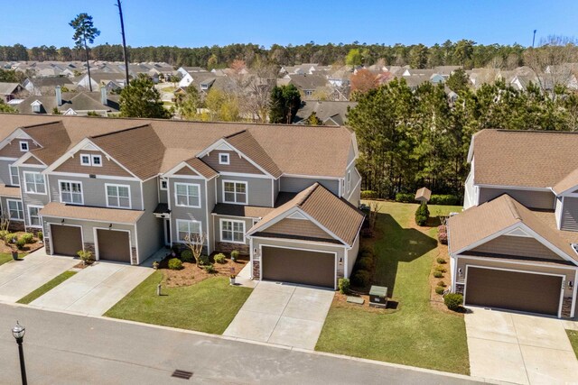 212 Machrie Loop Unit D, Myrtle Beach, SC 29588 - view of front of house featuring stone siding, a garage, concrete driveway, and a residential view
