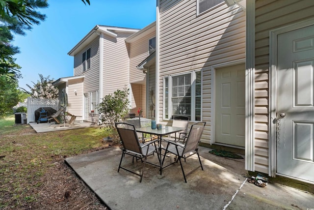 view of patio / terrace with central AC and outdoor dining area