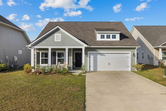 1176 Harbison Cir, Myrtle Beach, SC 29579 - view of front of home with a porch, a front yard, central air condition unit, and a shingled roof