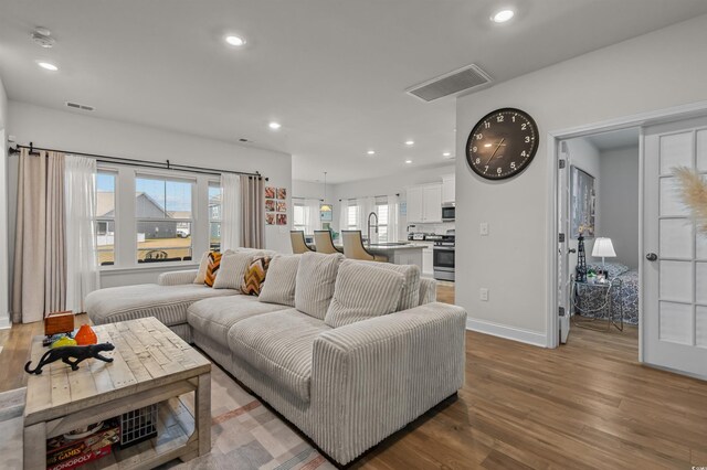 1176 Harbison Cir, Myrtle Beach, SC 29579 - living room featuring wood finished floors, recessed lighting, and baseboards