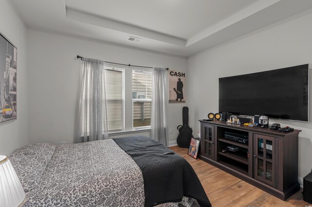 1176 Harbison Cir, Myrtle Beach, SC 29579 - bedroom with wood finished floors and a tray ceiling