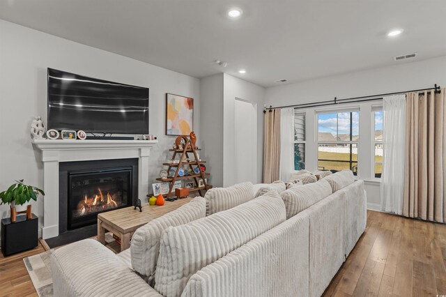 1176 Harbison Cir, Myrtle Beach, SC 29579 - living area with hardwood / wood-style floors, a fireplace with flush hearth, and recessed lighting