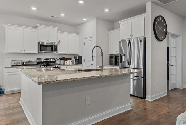 1176 Harbison Cir, Myrtle Beach, SC 29579 - kitchen featuring stainless steel appliances, a sink, an island with sink, white cabinets, and recessed lighting