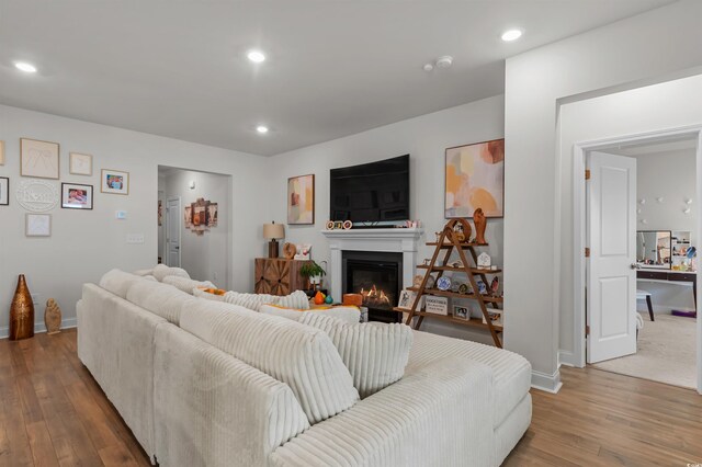 1176 Harbison Cir, Myrtle Beach, SC 29579 - living room featuring wood finished floors, baseboards, recessed lighting, and a glass covered fireplace