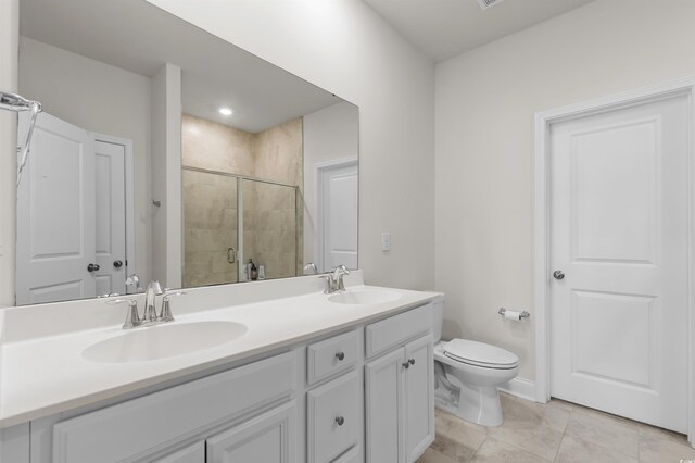 1176 Harbison Cir, Myrtle Beach, SC 29579 - bathroom with a stall shower, toilet, double vanity, and tile patterned floors