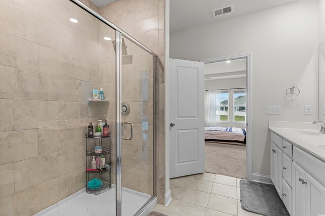 1176 Harbison Cir, Myrtle Beach, SC 29579 - ensuite bathroom with a stall shower, tile patterned flooring, and vanity