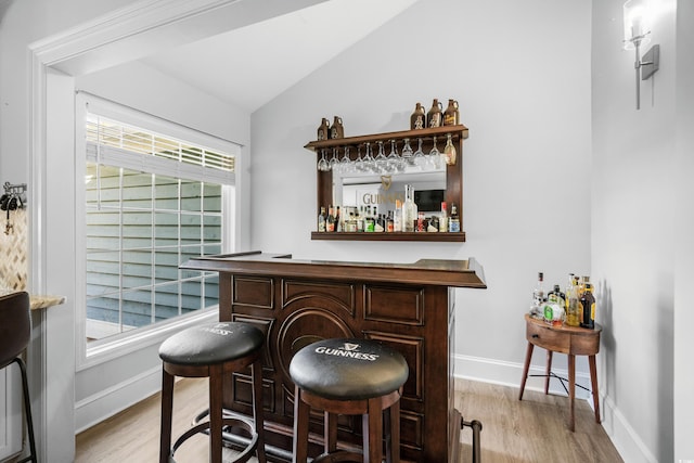 160 Shipmaster Ave, Pawleys Island, SC 29585 - indoor dry bar featuring wood finished floors, vaulted ceiling, and baseboards