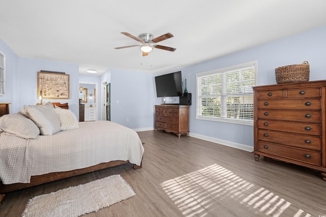 160 Shipmaster Ave, Pawleys Island, SC 29585 - bedroom featuring wood finished floors, baseboards, connected bathroom, and ceiling fan