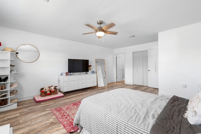 160 Shipmaster Ave, Pawleys Island, SC 29585 - bedroom with wood finished floors, baseboards, a closet, and ceiling fan