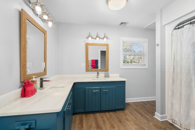 160 Shipmaster Ave, Pawleys Island, SC 29585 - full bath with double vanity, wood finished floors, a shower with curtain, and baseboards