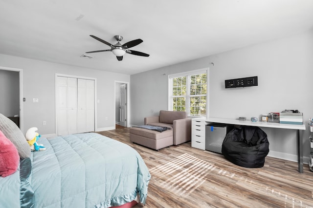 160 Shipmaster Ave, Pawleys Island, SC 29585 - bedroom featuring wood finished floors, baseboards, a closet, ceiling fan, and fridge