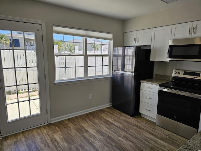 703 S 1st Ave S Unit 34D, North Myrtle Beach, SC 29582 - kitchen featuring stainless steel appliances, dark wood-style floors, white cabinetry, and baseboards