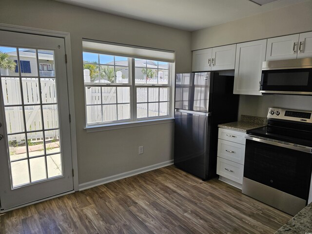 703 S 1st Ave S Unit 34D, North Myrtle Beach, SC 29582 - kitchen featuring stainless steel appliances, dark wood-style floors, white cabinetry, and baseboards