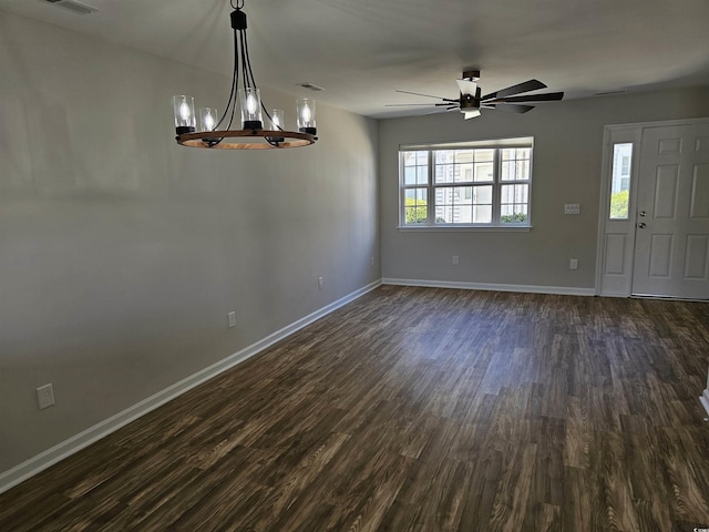 703 S 1st Ave S Unit 34D, North Myrtle Beach, SC 29582 - unfurnished dining area featuring ceiling fan, baseboards, dark wood finished floors, and a chandelier