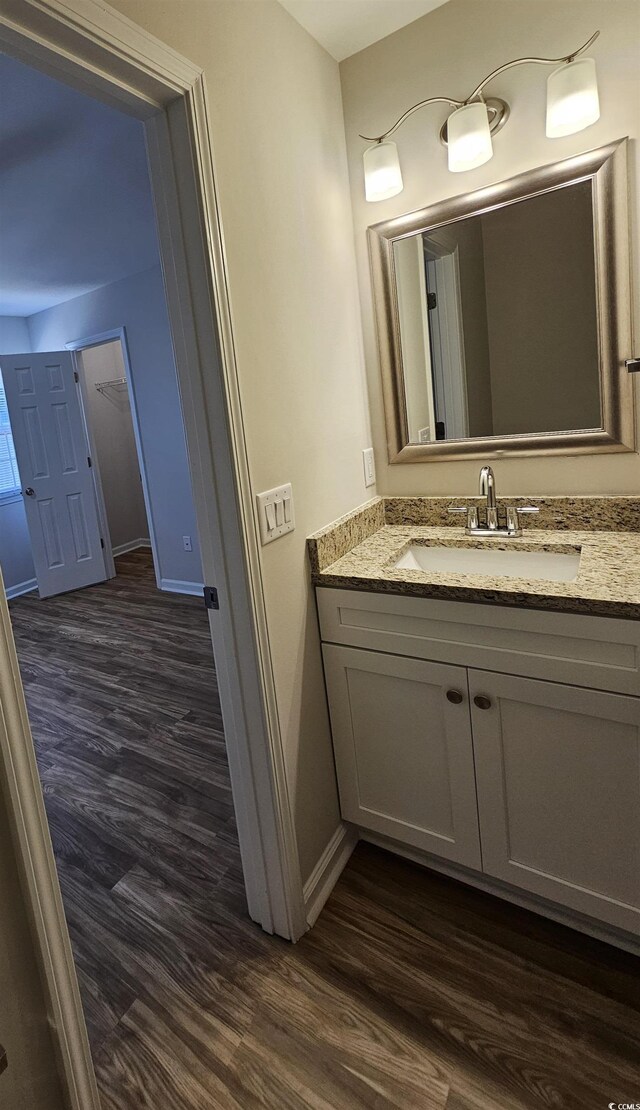 703 S 1st Ave S Unit 34D, North Myrtle Beach, SC 29582 - bathroom with wood finished floors, baseboards, and vanity