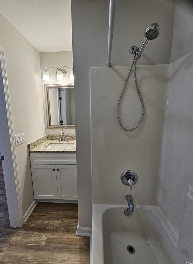 703 S 1st Ave S Unit 34D, North Myrtle Beach, SC 29582 - full bathroom featuring wood finished floors, shower / bath combination, vanity, and baseboards