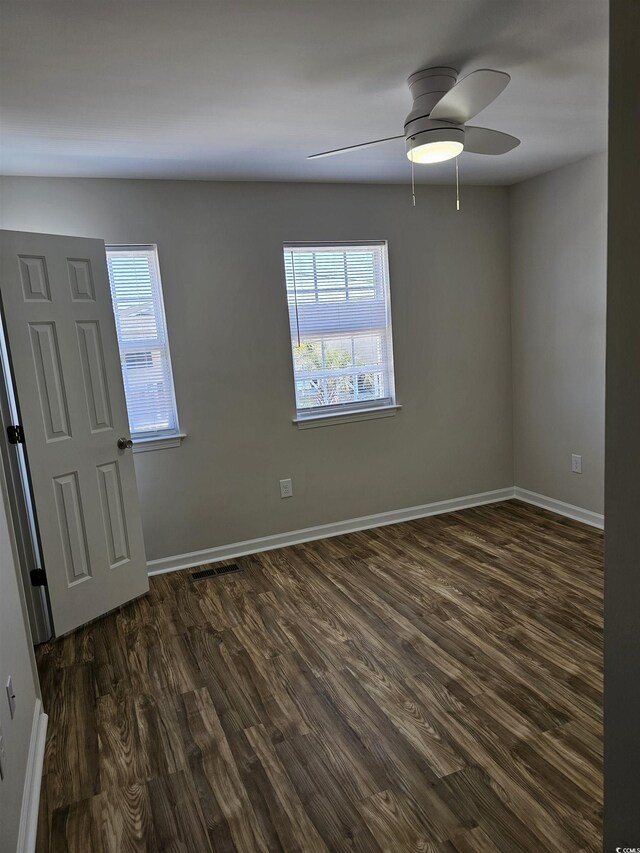 703 S 1st Ave S Unit 34D, North Myrtle Beach, SC 29582 - unfurnished room with dark wood-style flooring, a ceiling fan, and baseboards