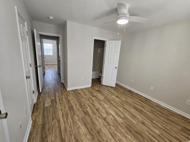 703 S 1st Ave S Unit 34D, North Myrtle Beach, SC 29582 - unfurnished bedroom with baseboards, wood finished floors, and a ceiling fan