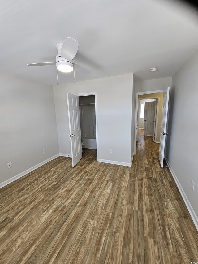 703 S 1st Ave S Unit 34D, North Myrtle Beach, SC 29582 - unfurnished bedroom with wood finished floors, baseboards, and ceiling fan
