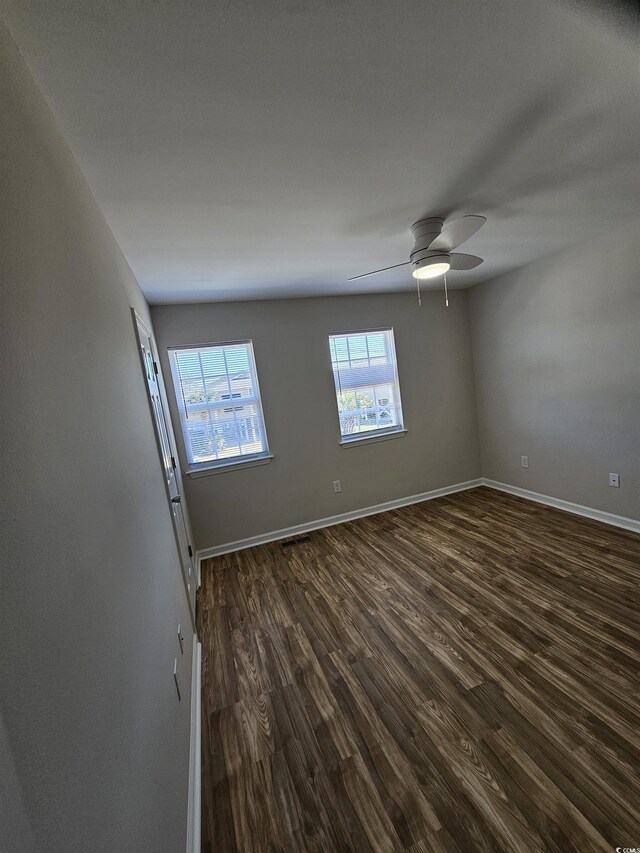 703 S 1st Ave S Unit 34D, North Myrtle Beach, SC 29582 - empty room featuring dark wood-type flooring, baseboards, and a ceiling fan