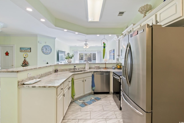 2180 Waterview Dr Unit 733, North Myrtle Beach, SC 29582 - kitchen with appliances with stainless steel finishes, a sink, a peninsula, light stone counters, and recessed lighting