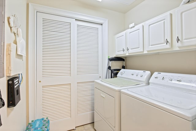2180 Waterview Dr Unit 733, North Myrtle Beach, SC 29582 - laundry area featuring washing machine and clothes dryer, cabinet space, and light tile patterned floors