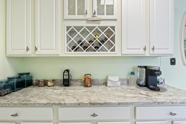 2180 Waterview Dr Unit 733, North Myrtle Beach, SC 29582 - kitchen with white cabinets, glass insert cabinets, and light stone countertops