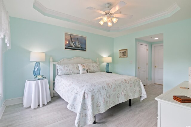 2180 Waterview Dr Unit 733, North Myrtle Beach, SC 29582 - bedroom with a raised ceiling, light wood finished floors, crown molding, baseboards, and a ceiling fan