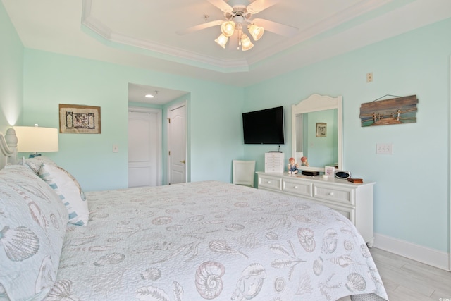 2180 Waterview Dr Unit 733, North Myrtle Beach, SC 29582 - bedroom with a raised ceiling, wood finished floors, ornamental molding, ceiling fan, and baseboards
