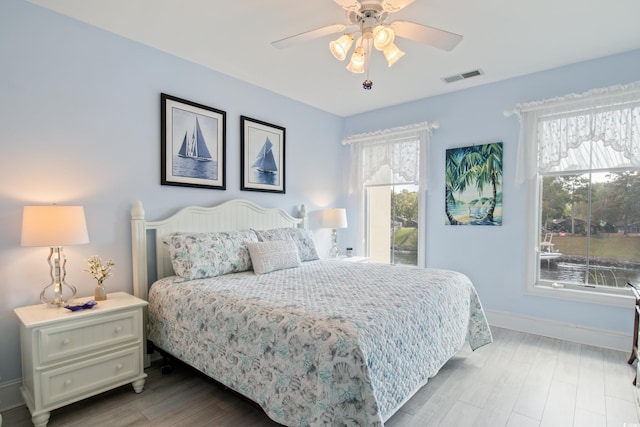 2180 Waterview Dr Unit 733, North Myrtle Beach, SC 29582 - bedroom featuring baseboards, light wood-style floors, and ceiling fan