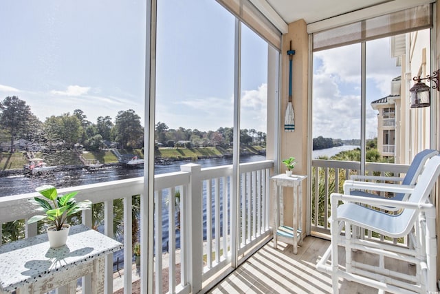 2180 Waterview Dr Unit 733, North Myrtle Beach, SC 29582 - sunroom / solarium featuring a water view, wood finished floors, and expansive windows