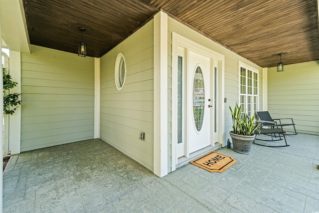 entrance to property featuring a porch