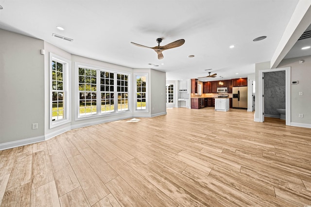unfurnished living room featuring visible vents, baseboards, ceiling fan, recessed lighting, and light wood-style flooring